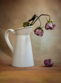 Close-up of white rose on table