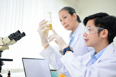 Female doctor examining patient in laboratory