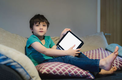 Boy sitting on mobile phone