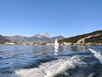 Scenic view of sea against clear blue sky