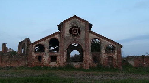 Low angle view of old building against sky