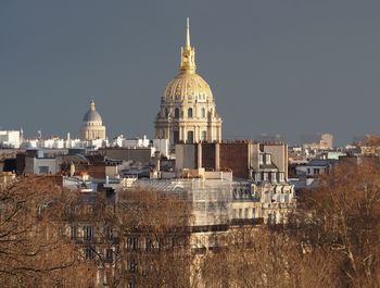 Cathedral in city against clear sky