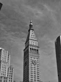Low angle view of clock tower against sky