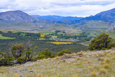 Scenic view of landscape and mountains against sky