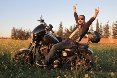 Man riding motorcycle on field