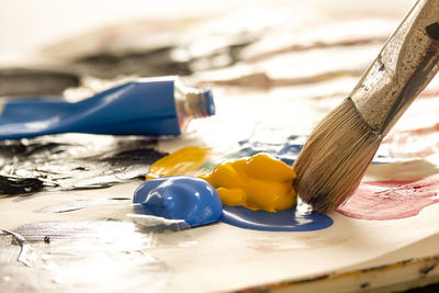 Close-up of paintbrushes on table