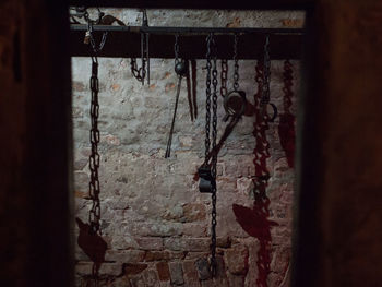 Close-up of abandoned hanging indoors