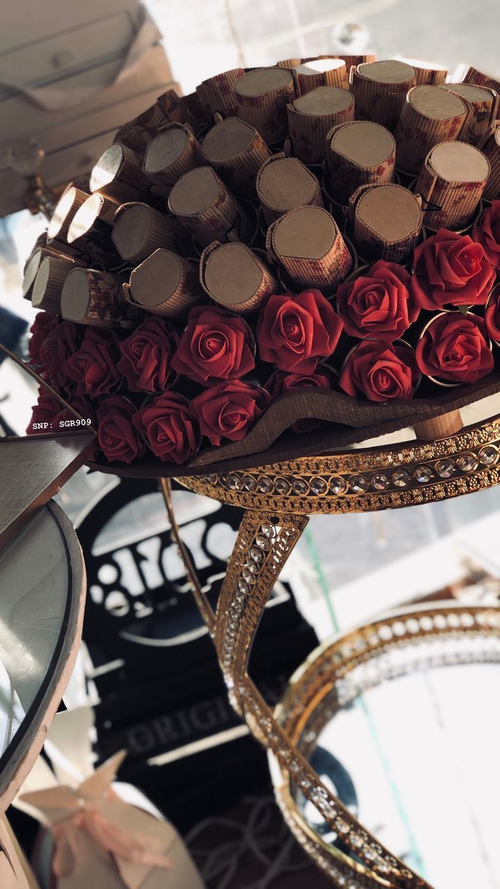 CLOSE-UP OF ROSES ON TABLE