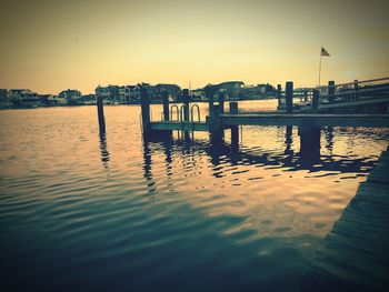 Scenic view of river against sky during sunset