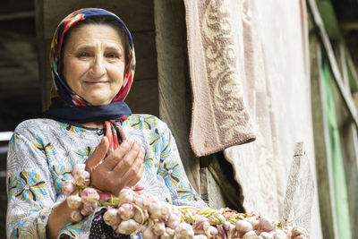 Portrait of senior woman in market