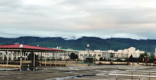 View of city against cloudy sky