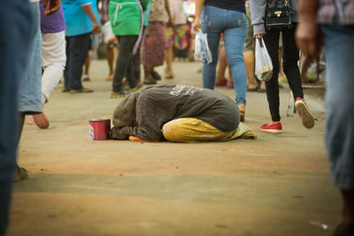 Low section of men with people on floor