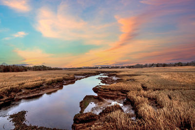 Sunset sky over the marsh and sesuit creek in east dennis in winter