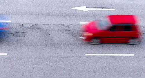 Blurred motion of car on road