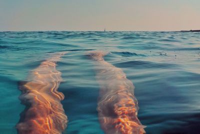 Swimming pool in sea against clear sky