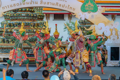 Group of people in temple outside building