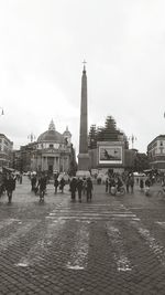 People at town square against sky