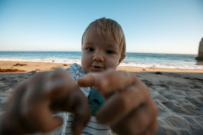 Low section of woman at beach