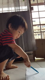 Cute boy playing at home