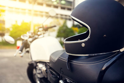 Close-up of helmet on motor scooter in city