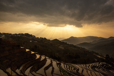 Scenic view of mountains against sky during sunset