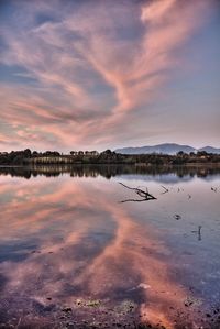 Scenic view of lake against sky during sunset