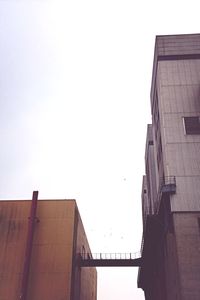 Low angle view of buildings against clear sky