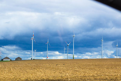 Wind mills in german fields. blue clouds on a background. high quality photo