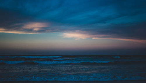 Scenic view of sea against sky at sunset