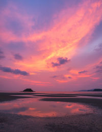 Scenic view of sea against romantic sky at sunset