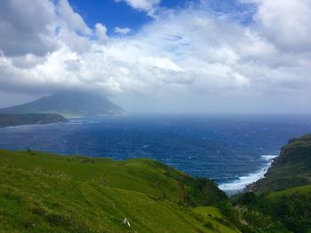 Scenic view of sea against cloudy sky