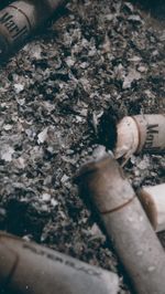 High angle view of cigarette on ground