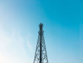 Low angle view of communications tower against sky