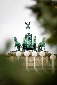 Low angle view of statue against sky