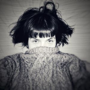 Close-up portrait of woman wearing mask