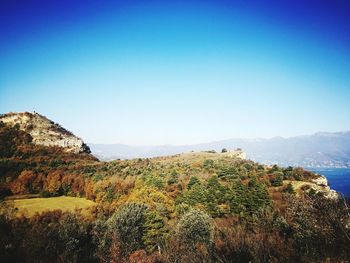 Scenic view of landscape against clear blue sky