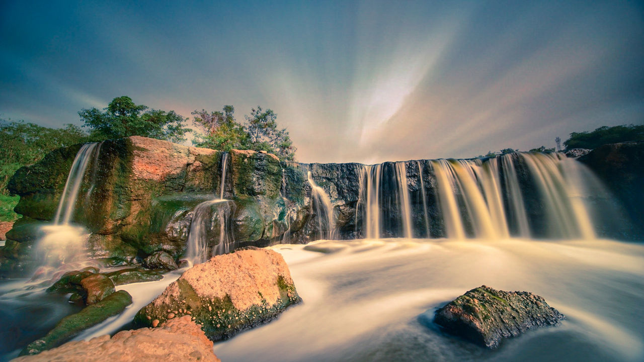 long exposure, waterfall, blurred motion, water, scenics - nature, flowing water, motion, beauty in nature, nature, sky, solid, rock, rock - object, no people, tree, flowing, plant, day, idyllic, outdoors, falling water, power in nature
