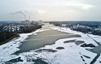 Road in city against sky during winter