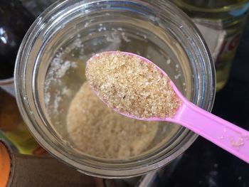 High angle view of ice cream in glass jar on table