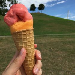 Close-up of hand holding ice cream cone