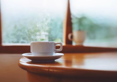 Close-up of coffee cup on table