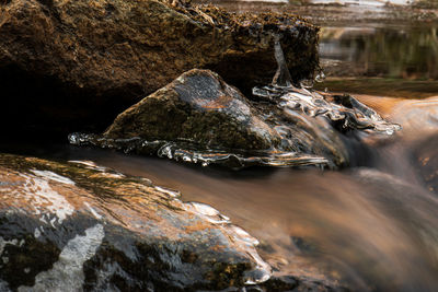 Scenic view of sea by rock formation