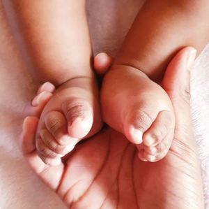 Low section of baby feet