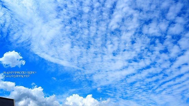 low angle view, sky, blue, cloud - sky, cloudy, cloud, communication, nature, beauty in nature, scenics, tranquility, white color, no people, outdoors, day, cloudscape, text, western script, white, tranquil scene