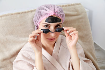 Close-up of young woman wearing sunglasses