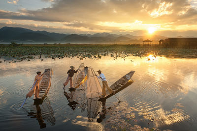 Scenic view of lake against sky during sunset