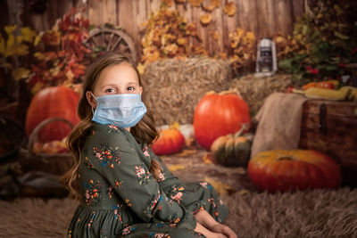 Portrait of a girl in a witch costume, preparing for halloween. 