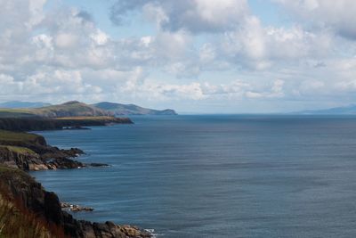 Scenic view of sea against cloudy sky