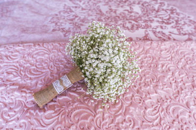 High angle view of pink flower on table