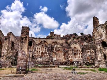 Old building against cloudy sky